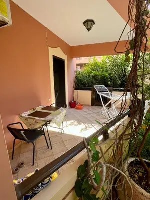 a view of a patio with a table and chairs at Rosmarino in Kissamos