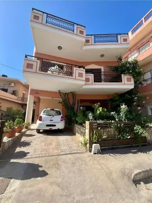 a white car parked in front of a building at Rosmarino in Kissamos