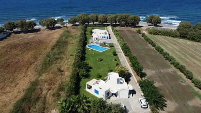 an aerial view of a house with the ocean in the background at Oasea in Tavronitis