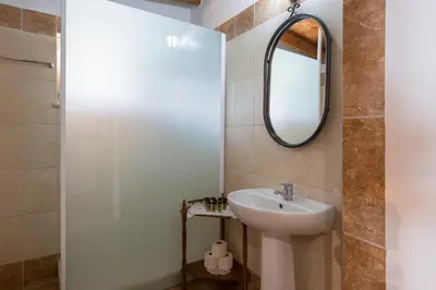 a bathroom with a sink and a mirror at Villa Drakona in Keramia