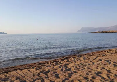 a beach with a large body of water at Seaside Villa Balos in Kissamos
