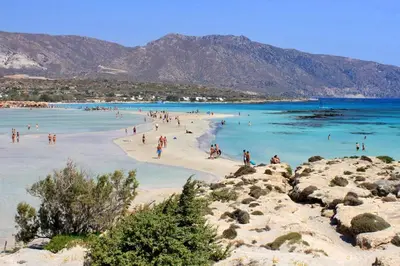 a group of people on a beach in the water at Seaside Villa Balos in Kissamos
