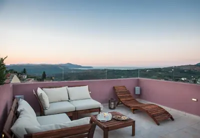 a balcony with two couches and a table at Listen to Nature in a Renovated Traditional Hilltop Villa Liodosifis with Heated Pool in Païdhokhórion