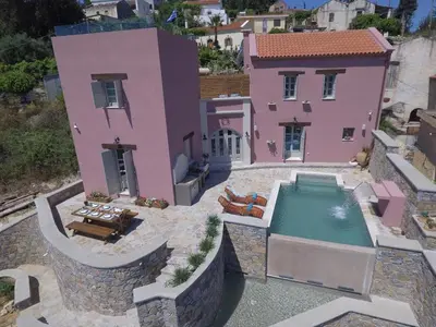 an aerial view of a house with a swimming pool at Listen to Nature in a Renovated Traditional Hilltop Villa Liodosifis with Heated Pool in Païdhokhórion