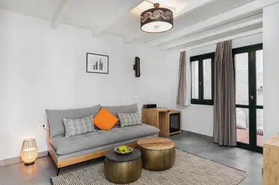 a living room with a couch and a table at Kamares Sanctuaries in Kolymvari