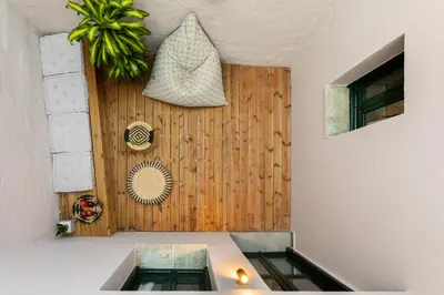 a room with a sink and a wooden wall at Kamares Sanctuaries in Kolymvari