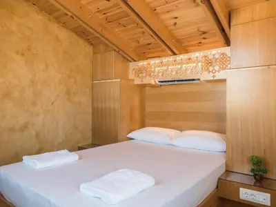 a small bedroom with two beds in a room at Evans House II in Chania Town