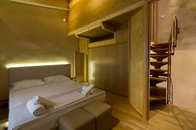 a bedroom with a bunk bed and a staircase at Evans House II in Chania Town