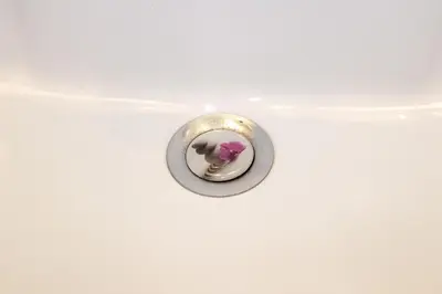a metal button with a pink flower in it at Central luxurious Apartment with sea view! in Chania Town