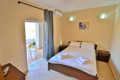 a bedroom with a bed with two towels on it at Beach House in Kissamos