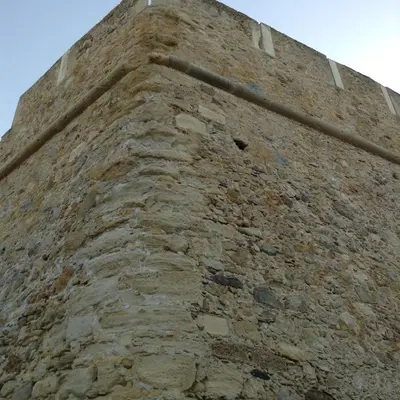 a tall brick wall with at Beach House in Kissamos