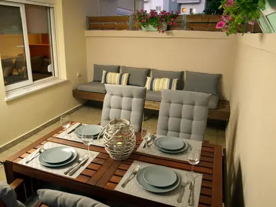 a living room with a table and a couch at Urban Sea Apts in Chania Town