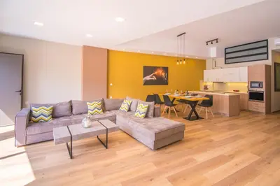 a living room with a couch and a table at UTOPIA luxury apartment in Chania Town