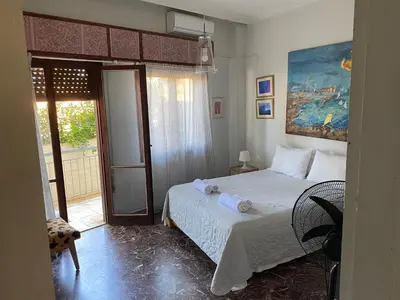 a bedroom with a bed with towels on it at Art Home in Chania Town