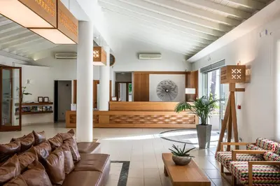a living room with a couch and a table at Stellina Village in Kato Daratso