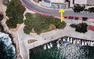 an overhead view of a marina with boats and a road at EUPHORIA Luxury Apartment in Chania Town