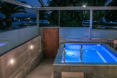 a swimming pool on the roof of a house at EUPHORIA Luxury Apartment in Chania Town
