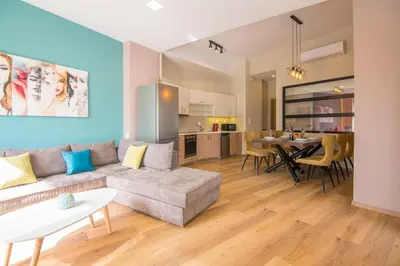 a living room with a couch and a table at EUPHORIA Luxury Apartment in Chania Town