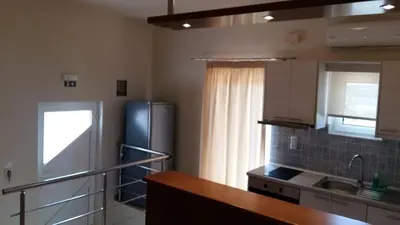 a kitchen with a refrigerator and a counter top at Kallicrates Village in Frangokastello