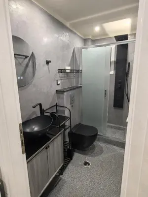 a bathroom with a sink and a toilet in it at Nina Apartment in Chania Town