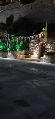 a street with a clothes line with flags on it at Nina Apartment in Chania Town