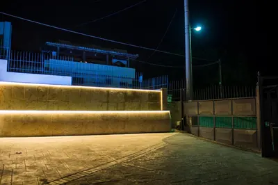 a street light in front of a building at night at The Hill House Villa in Kato Daratso