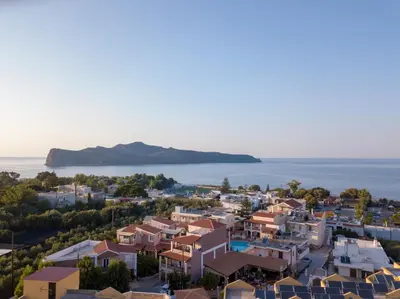 an aerial view of a town with houses and the ocean at Hotel Mimoza in Agia Marina Nea Kydonias