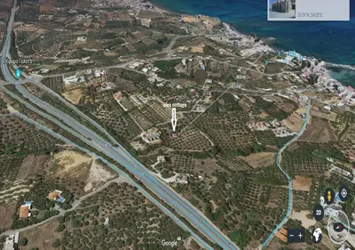 a map of a city with a road and the ocean at Olea Cottage in Galatás
