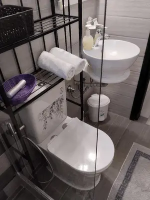 a bathroom with a toilet and a sink at Olea Cottage in Galatás