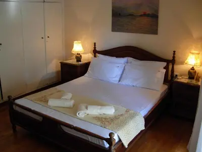 a bedroom with a bed with two towels on it at Michele's Flat in Chania Town