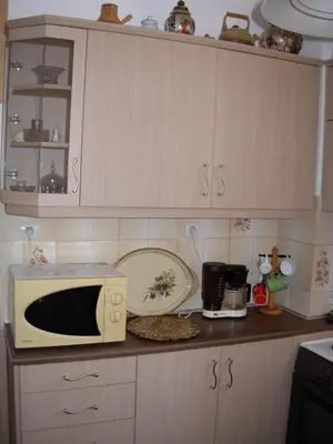 a kitchen with a microwave and a plate on a counter at Michele's Flat in Chania Town
