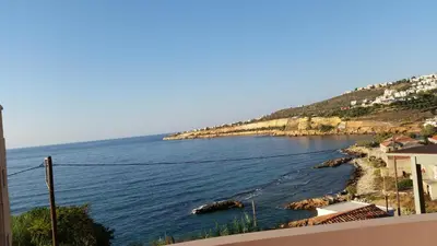 a view of the ocean from a building at Amazing Sea View Apartment in Chania Town