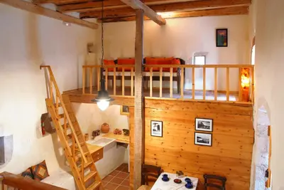 a room with a bunk bed and a ladder at Villa Irini - Authentic Cretan Retreat with Private Pool in Vafés