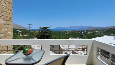 a bowl of vegetables sitting on a table on a balcony at Thealia in Karefilianá