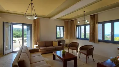 a living room with a couch and a table at Thealia in Karefilianá