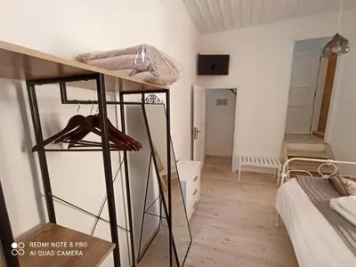 a small room with a bunk bed and a room with at Casa Topane in Chania Town