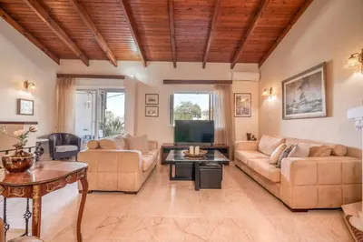a living room with a couch and a table at Kalliopi's Maisonette in Chania Town