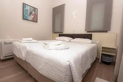 a bedroom with two beds with towels on them at SUPERIOR VILLA MARINA MARE Sauna - Hammam - Pool - 250m from Beach in Agia Marina Nea Kydonias