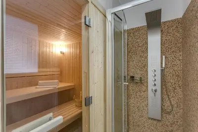 a bathroom with a shower and a bath tub at SUPERIOR VILLA MARINA MARE Sauna - Hammam - Pool - 250m from Beach in Agia Marina Nea Kydonias