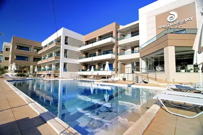 a large swimming pool in front of a building at Nautilus Bay Hotel in Kissamos