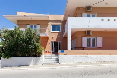 a building with a staircase in front of it at Villa Armonia Chania in Kato Galatas
