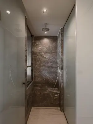 a bathroom with a shower with a glass door at Sunny Bay Hotel in Kissamos