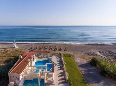 an aerial view of a house and the beach at Hotel Caretta Beach in Gerani Chanion