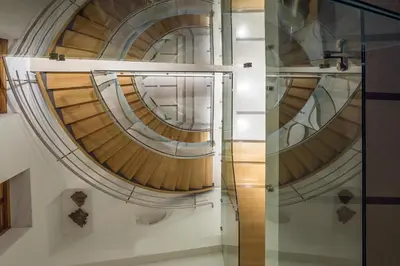 a glass elevator in a building with wooden floors at Casa Delfino Hotel & Spa in Chania Town
