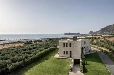 an aerial view of a house with the ocean in the background at Casa le Cicale in Falasarna