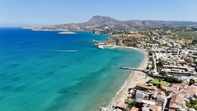 an aerial view of a beach with houses and the ocean at Villa Vangelis Stylos Crete in Khiliomoudhoú