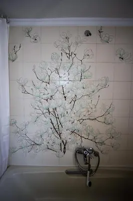 a painting of a tree on a tiled wall at Sunhouse-CH in Chania Town