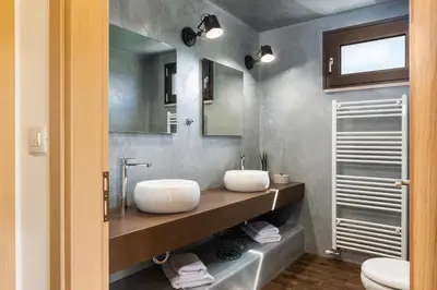a bathroom with a sink and a mirror at Villa Kudos in Maleme