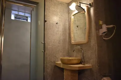 a bathroom with a wooden sink and a mirror at Odos Oneiron Boutique Hotel in Chania Town