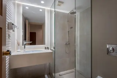 a bathroom with a shower and a sink at Mirtilos Studios & Apartments in Kissamos